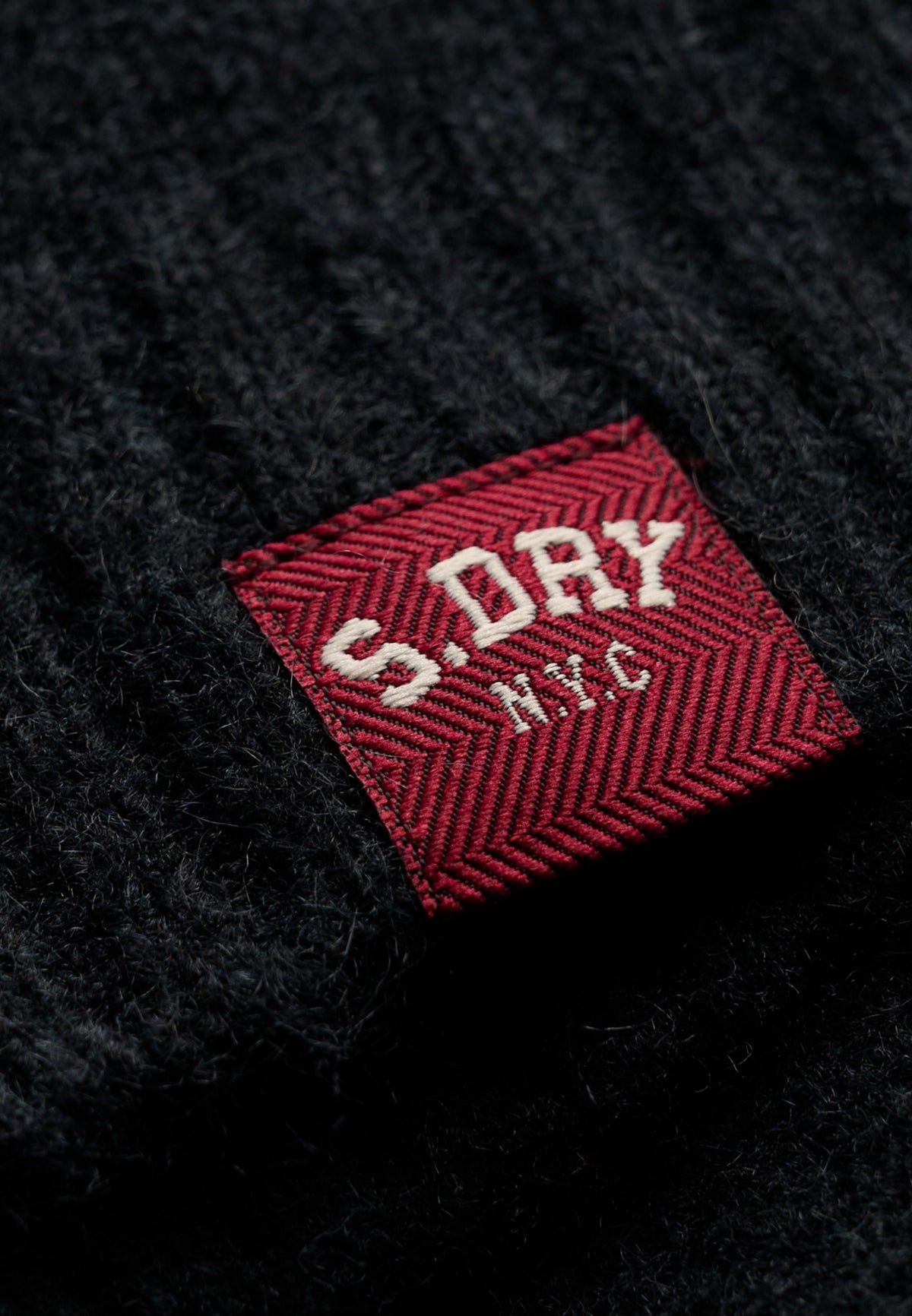 Superdry Bardot Knitted Jumper in Eclipse Navy logo patch detail