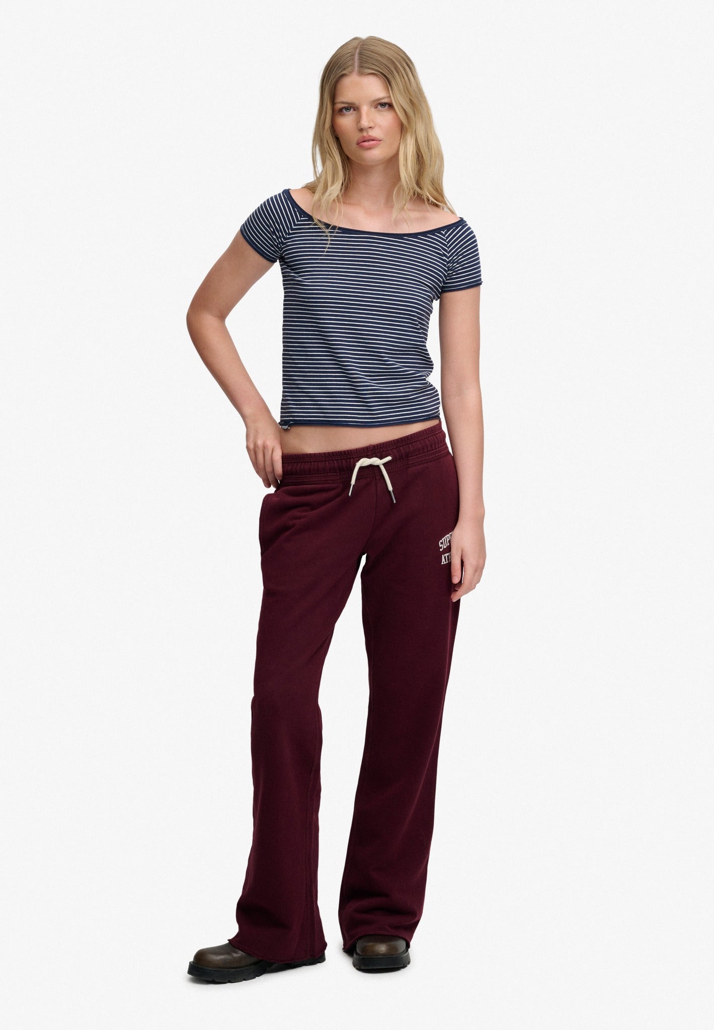 Superdry Athletic Embroidered Flare Jogger in Port Red angled view on model