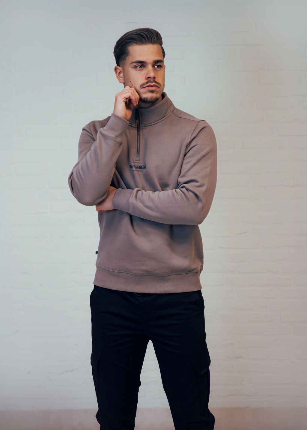 Titan Taupe quarter-zip sweatshirt worn by standing model, front view