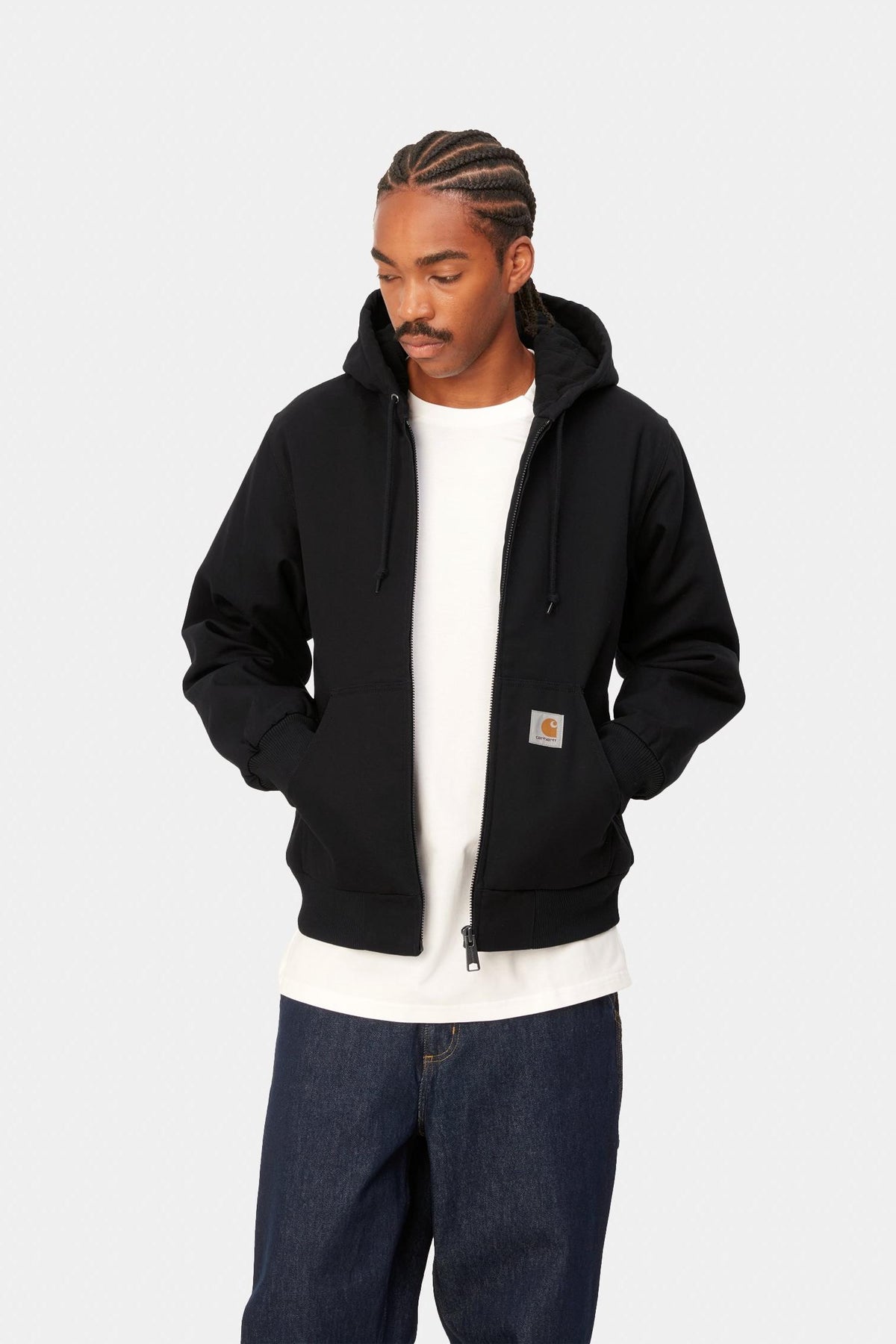 Model wearing the Carhartt WIP Active Jacket in Black Rigid, open front view