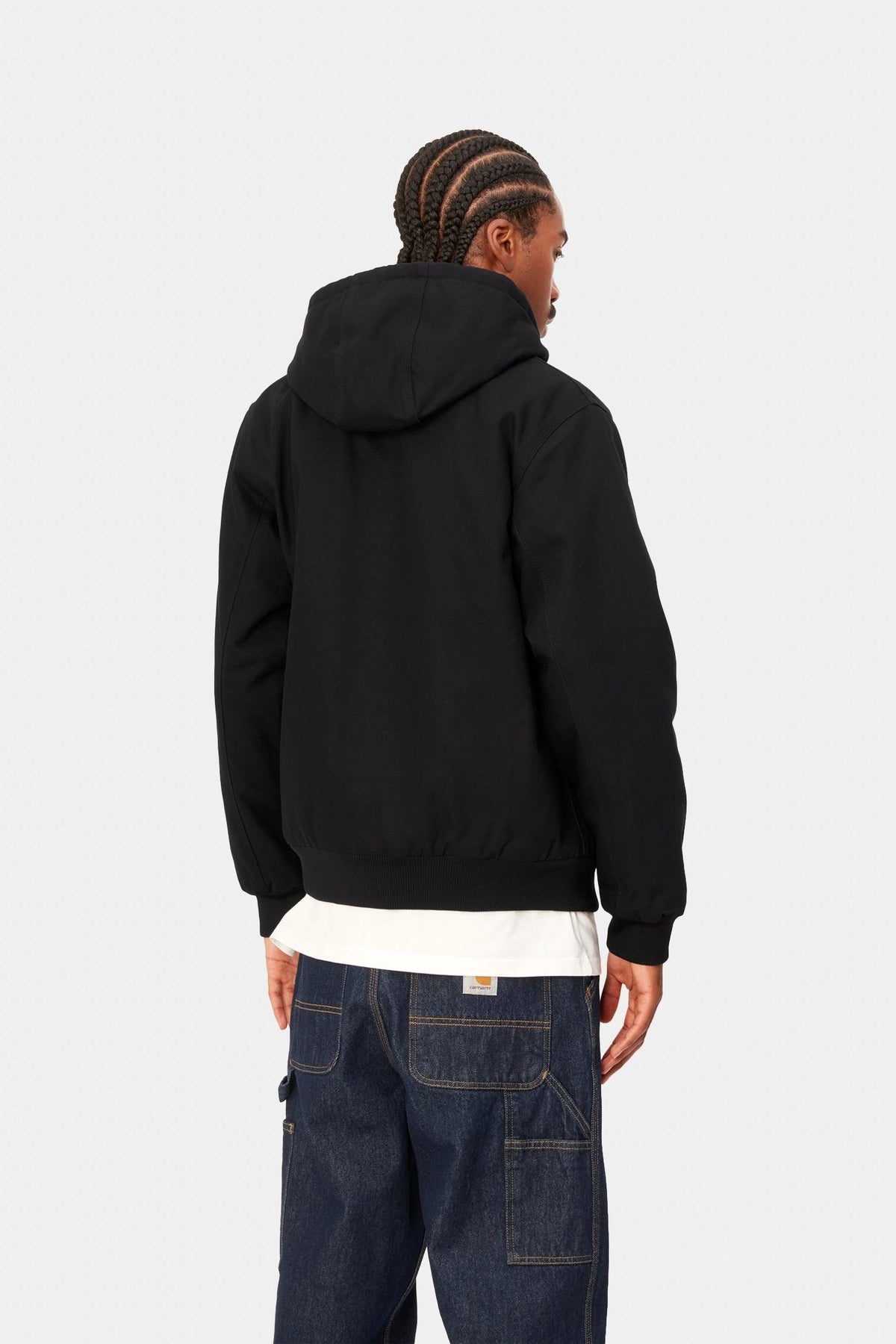 Model wearing the Carhartt WIP Active Jacket in Black Rigid, rear view
