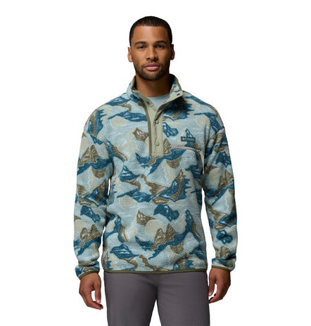 Man wearing a patterned pullover on a white background