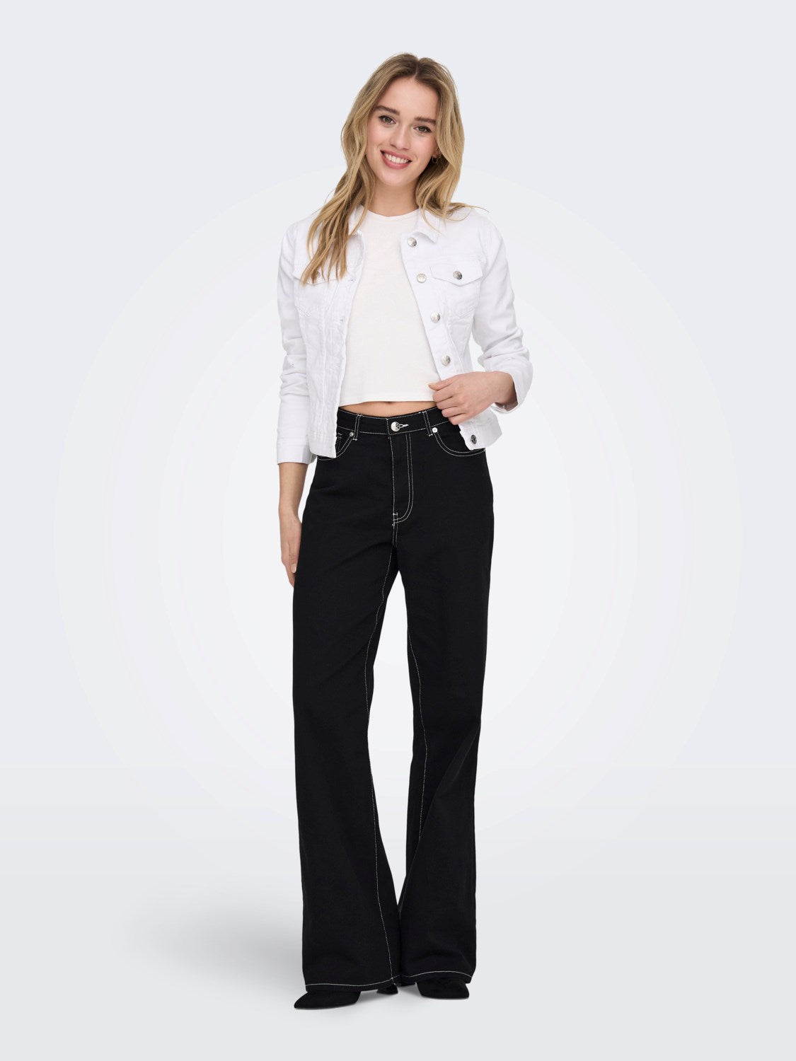 Full-length front view of the ONLY Wonder white denim jacket on model