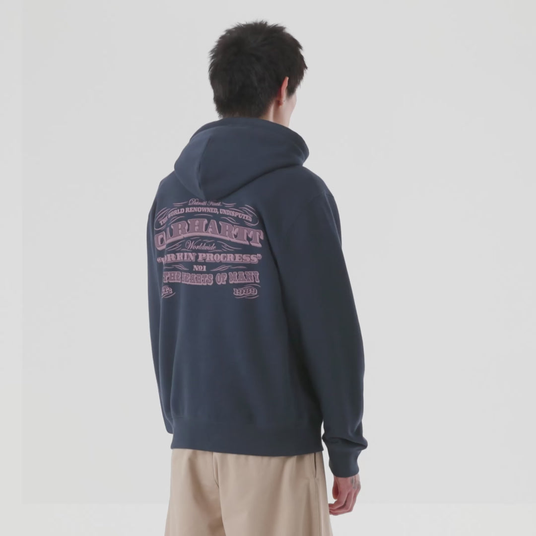 Person wearing a dark blue hoodie with purple front and back print