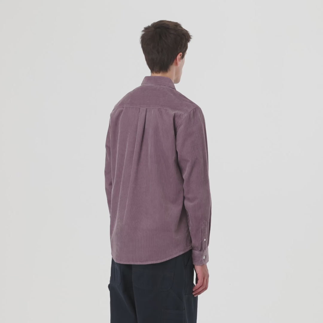 Man wearing a mauve corduroy button-up shirt