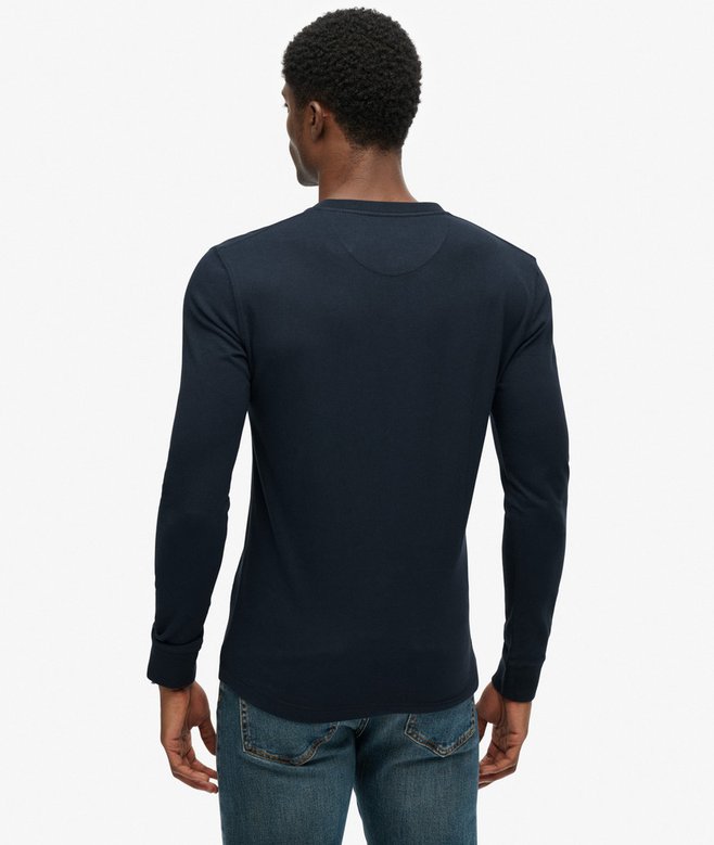 Man wearing a black long-sleeve shirt on a white background