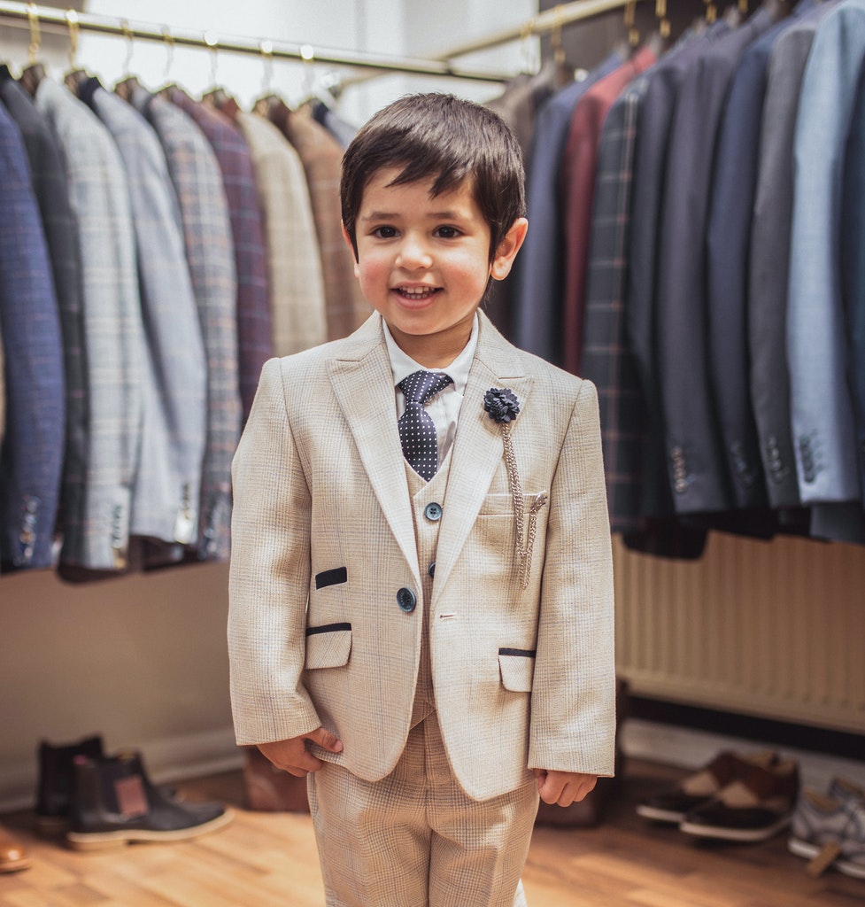 Detail view of Caridi cream boys suit