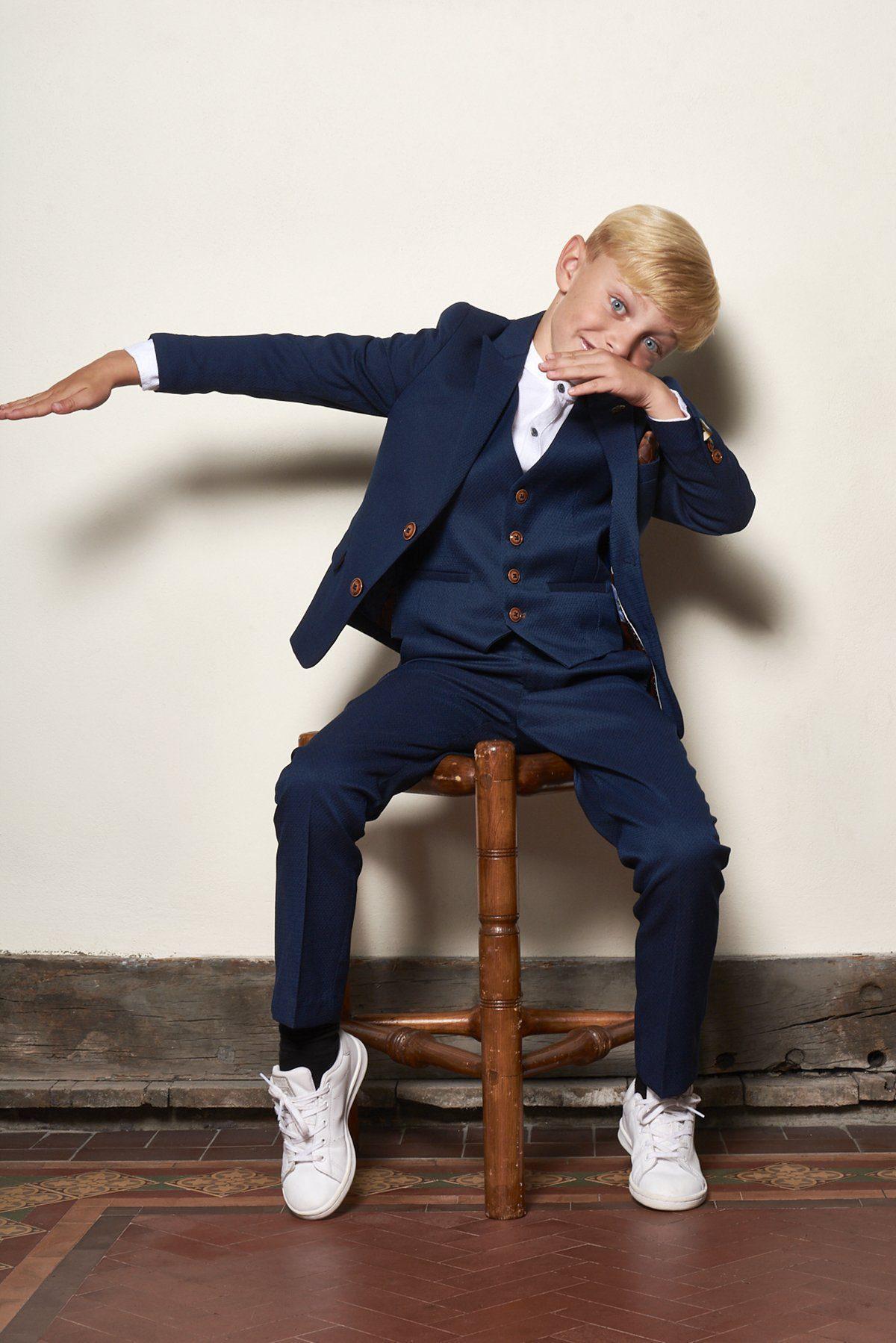 Angled view of boys royal blue formal suit