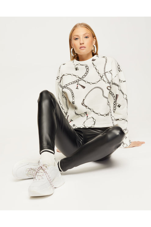 Detail view of black faux leather leggings