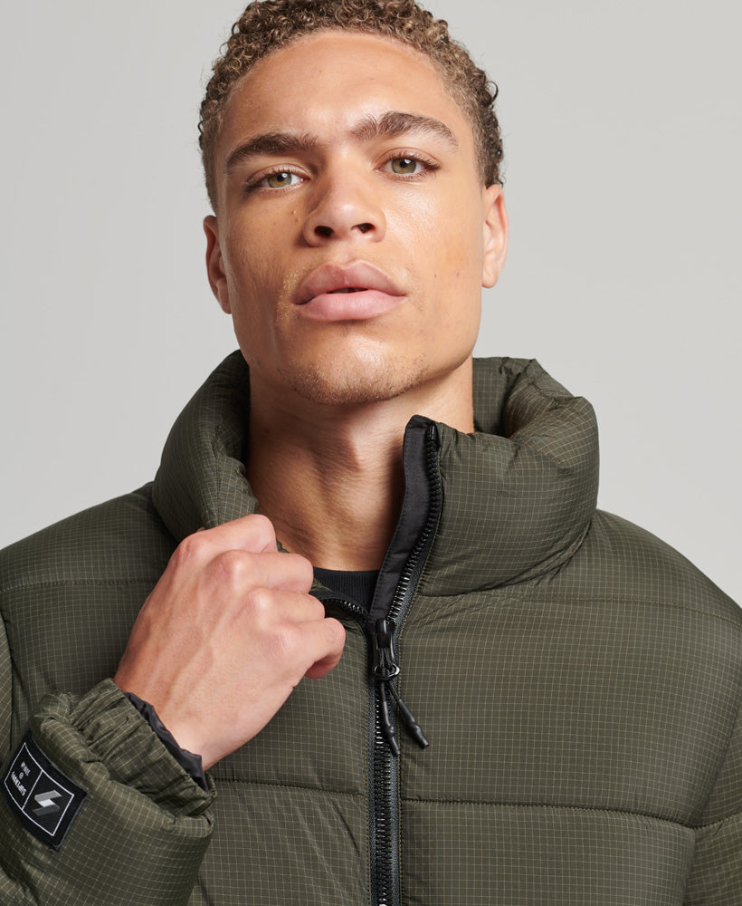 SUPERDRY Sports Puffer Non hooded Jacket Football Grid Khaki Football Grid Khaki model front view