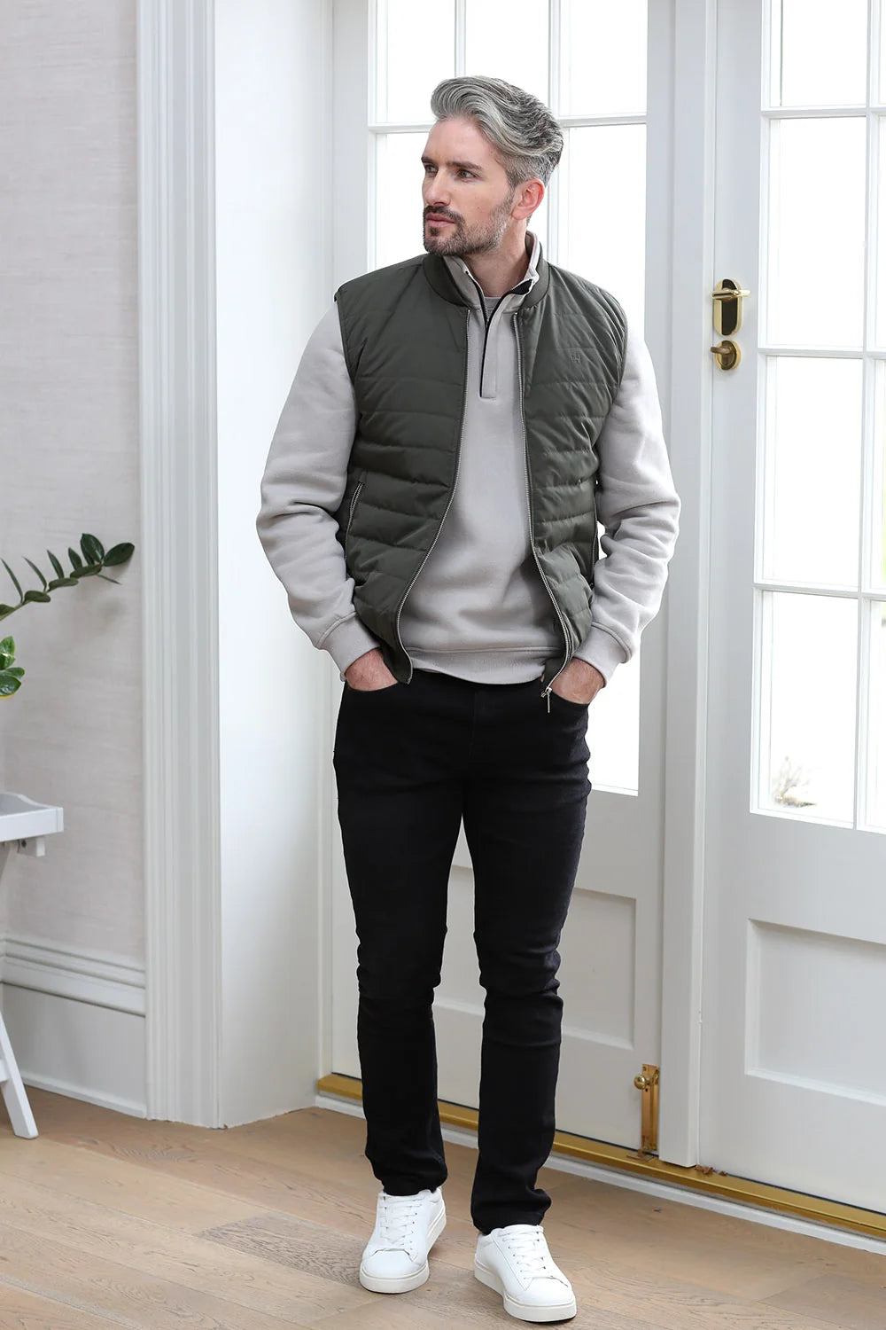 Kenrow Andy Gilet in light khaki worn by model with hands in pockets, front view