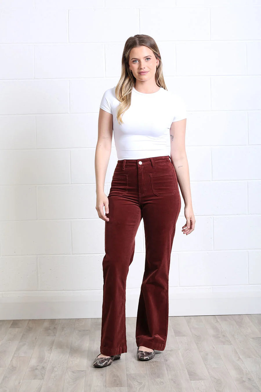 Rant & Rave Bridget cord wide leg trousers in terracotta, front model view.