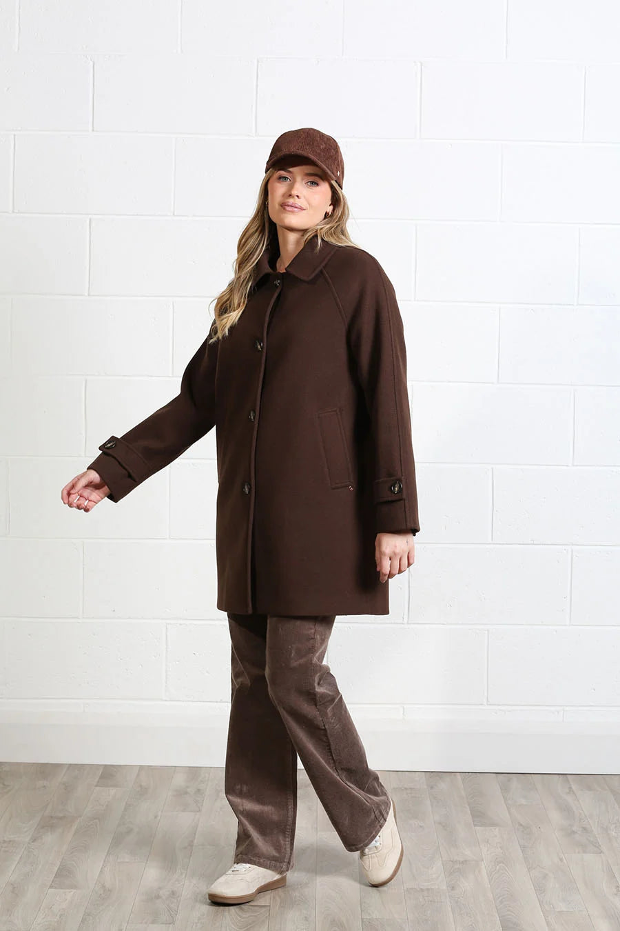 Rant & Rave Georgia Coat in chocolate brown worn by model, front view showing button front and pockets