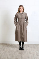 Rant & Rave Hazel Shirt Dress Biscuit in biscuit corduroy, front view worn by model with hands in pockets.