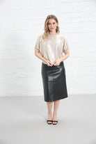 Rant & Rave Jenny Top in gold worn by model, front view with short sleeves and shimmering finish