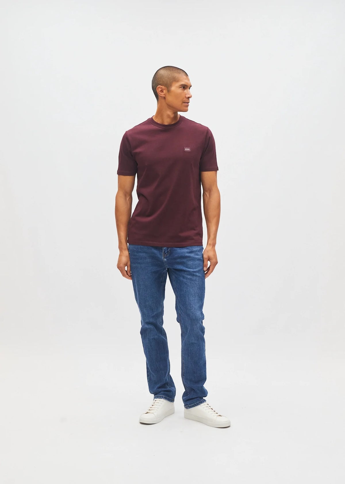 Diesel John Tee in deep burgundy worn by a model, angled front view