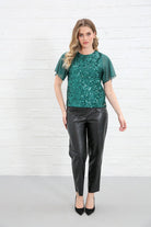Rant & Rave Kennedy Top in green sequin front view worn by model with black leather trousers