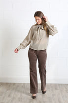 Rant & Rave Natalia top in Light Coffee, full - length front model view with tie neck and striped long sleeves.