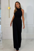 Girl In Mind Fifi halter tie jumpsuit in black, front angled model view
