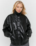 Tally Weijl Black Oversized Faux Leather Jacket worn by model, closed jacket view