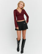 Tally Weijl Black Pleated Mini Skort worn by model, front view