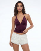 Tally Weijl white lace mini shorts worn by model, front view