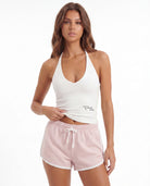 Tally Weijl white printed halter top worn by model, front view