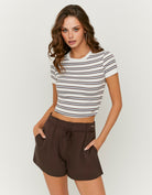 Tally Weijl white and brown striped T shirt worn by model, front view