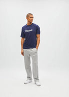 Diesel Walter Tee in navy worn by a model, angled front view with white Diesel logo across the chest.