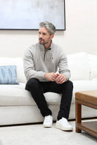 Kenrow Wesley Half Zip Putty worn by model seated on sofa