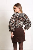 Rant & Rave Charlotte cord skirt in mocha, back model view showing the rear zip.