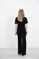 Rant & Rave Clara Trouser Black worn by model, back view, wide - leg velvet trousers with matching top