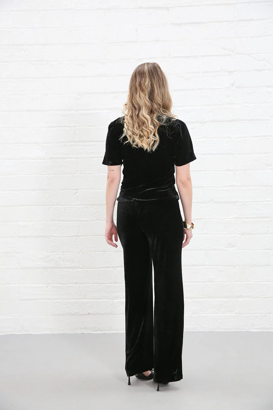 Rant & Rave Clara Trouser Black worn by model, back view, wide - leg velvet trousers with matching top