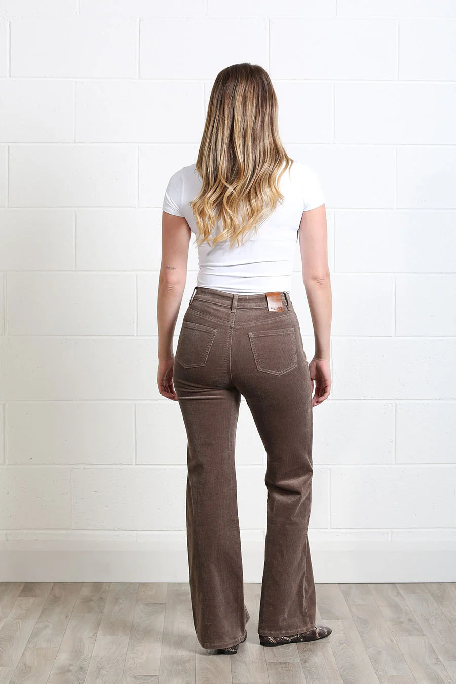 Rant & Rave Emily Wide Leg Cord Taupe trousers worn by a model, back view
