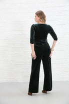 Rant & Rave Farrah Jumpsuit in green velvet, back view worn by model