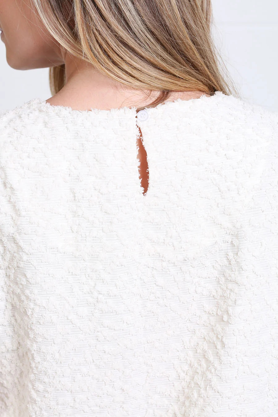 Rant & Rave Hannah top in cream, back neck detail with button fastening and textured fabric.