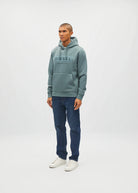 Diesel Jameson Hoodie in Green Meadow with chest logo, worn by a model in an angled view.