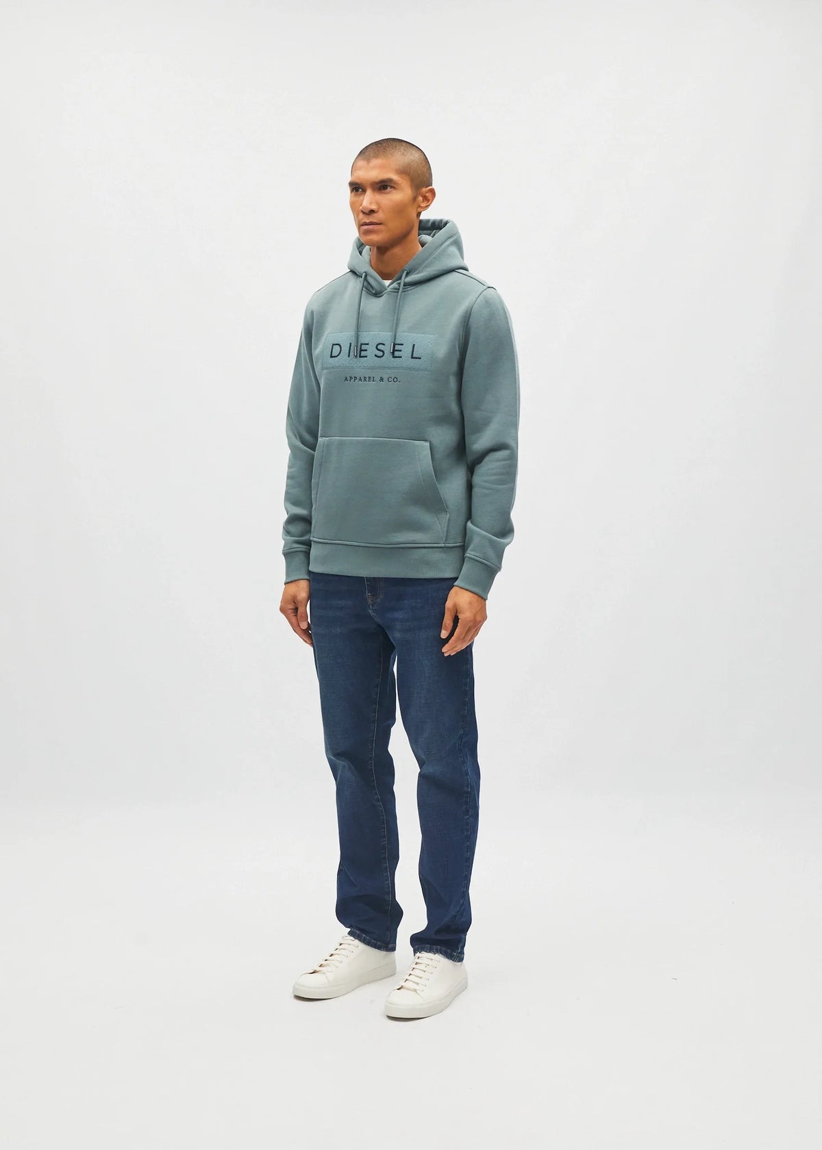 Diesel Jameson Hoodie in Green Meadow with chest logo, worn by a model in an angled view.