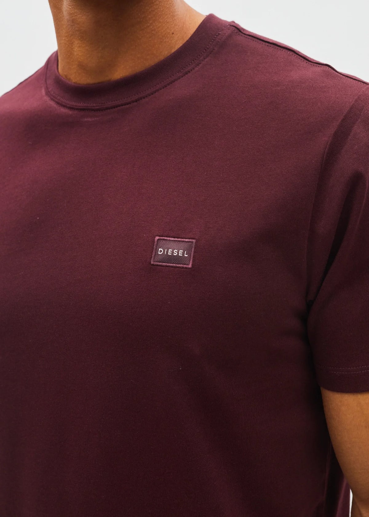 Diesel John Tee in deep burgundy, detail view of chest logo patch