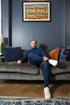 Kenrow Justin Half Zip Blue Melange sweater worn by model seated on a sofa
