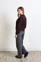 Rant & Rave Sarah Jumper in burgundy worn by model, side profile view showing relaxed fit