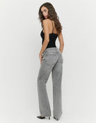 Tally Weijl grey low waist straight leg jeans worn by model, back angled view