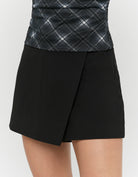 Tally Weijl Black Mini Skort worn by model, closer view