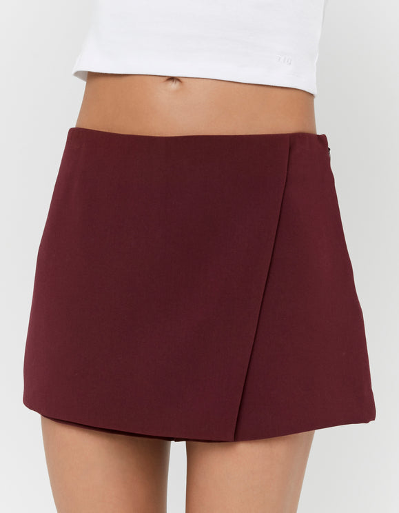 Tally Weijl Burgundy Mini Skort worn by model, side view