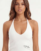 Tally Weijl white printed halter top worn by model, close - up front view