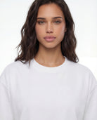 Tally Weijl white oversized basic T-shirt worn by model, neckline detail view