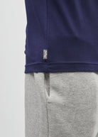 Detail view of the Diesel Walter Tee in navy showing the woven Diesel logo tag at the hem.