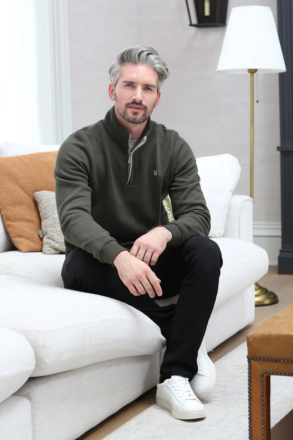 Kenrow Wesley Half Khaki quarter-zip sweater in khaki, model sitting on sofa