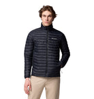 Person wearing a black Columbia jacket on a white background