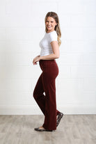 Rant & Rave Bridget cord wide leg trousers in terracotta, side model view.
